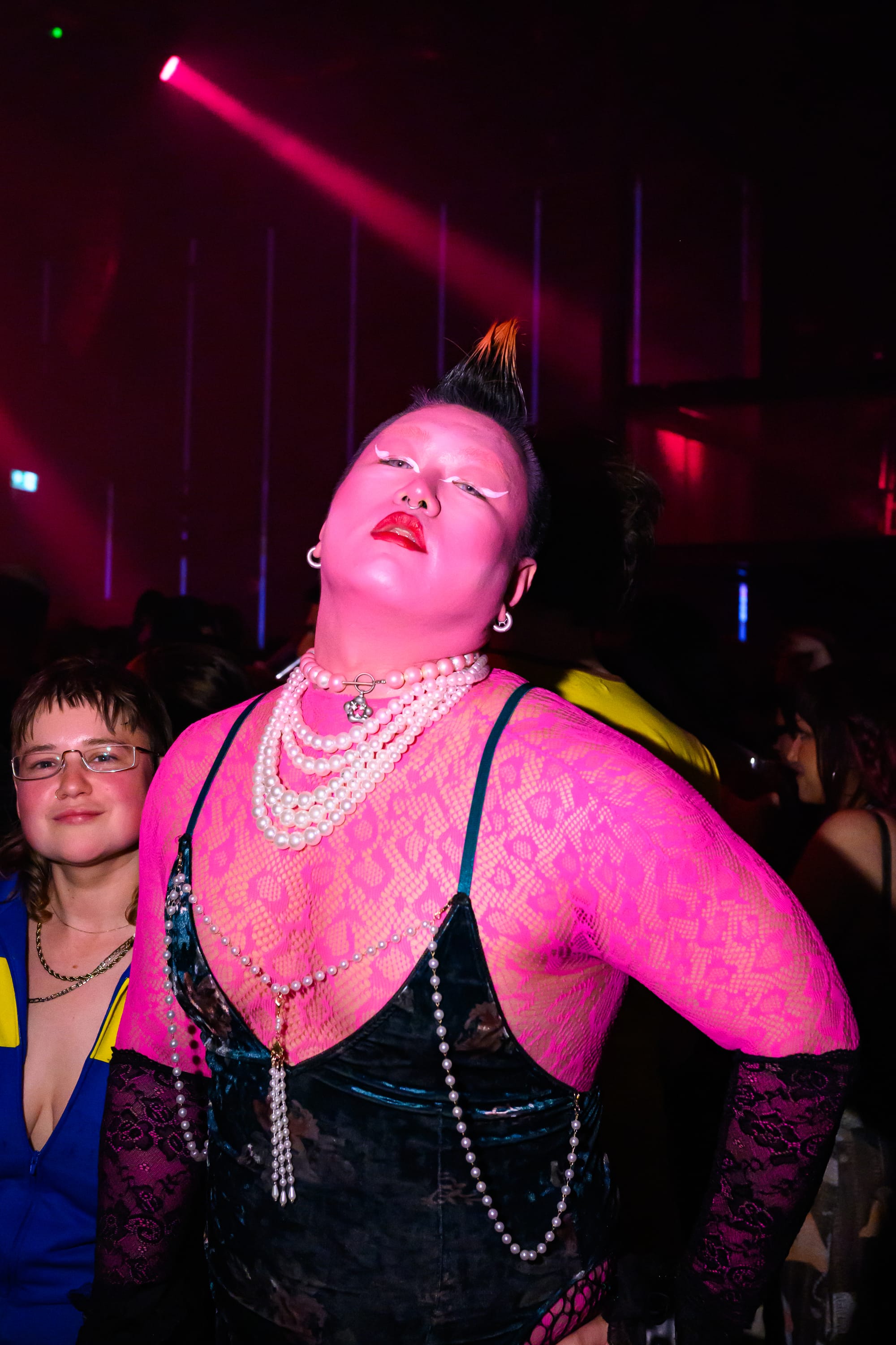 An incredibly fabulous person covered in pink and pearls.