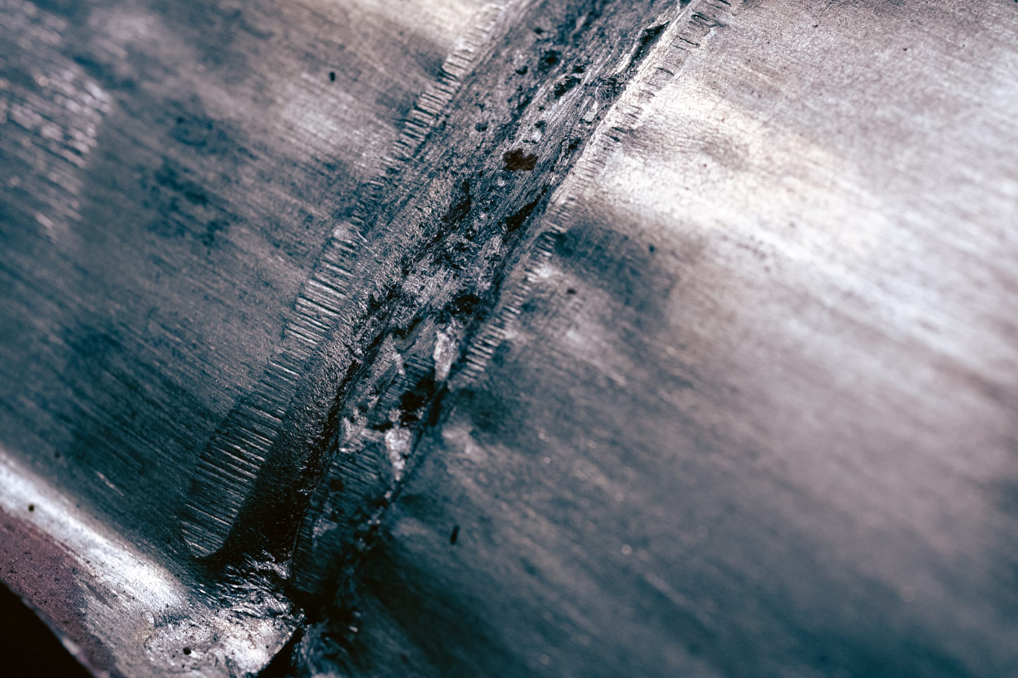 The weld between two car parts.