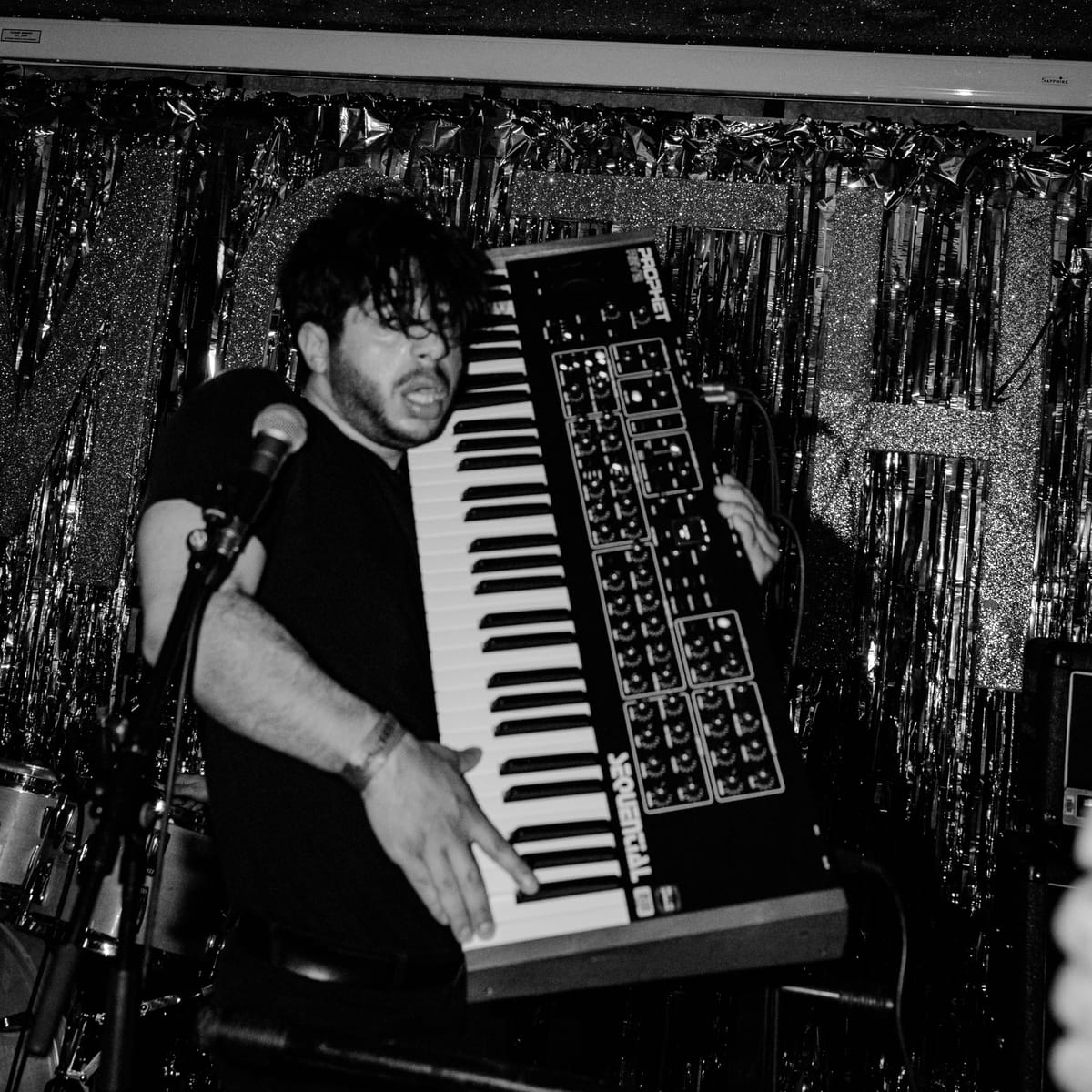 Moe Kazra rocking an improvised keytar by picking up a massive synth.